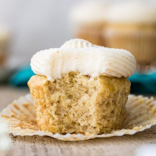 Frosted cupcake with a bite taken out of it.