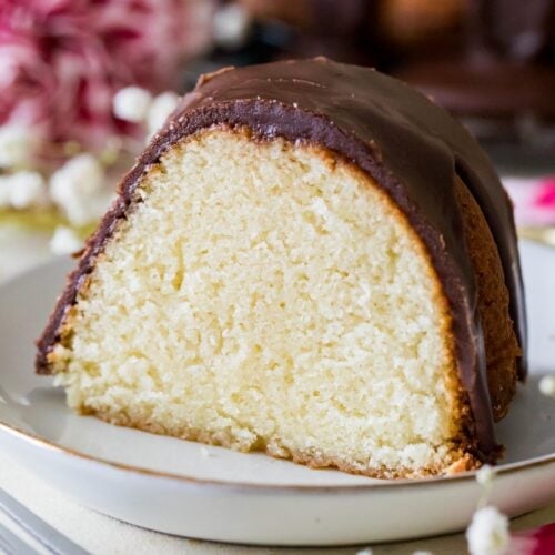 slice of hot milk cake topped with a fudgy chocolate frosting