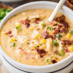 bowl of chicken corn chowder topped with bacon and green onions