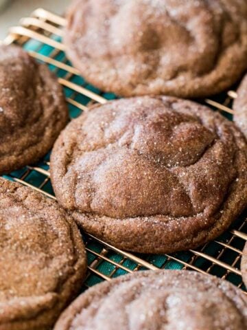 Chocolate snickerdoodles on a cooling rack after baking.