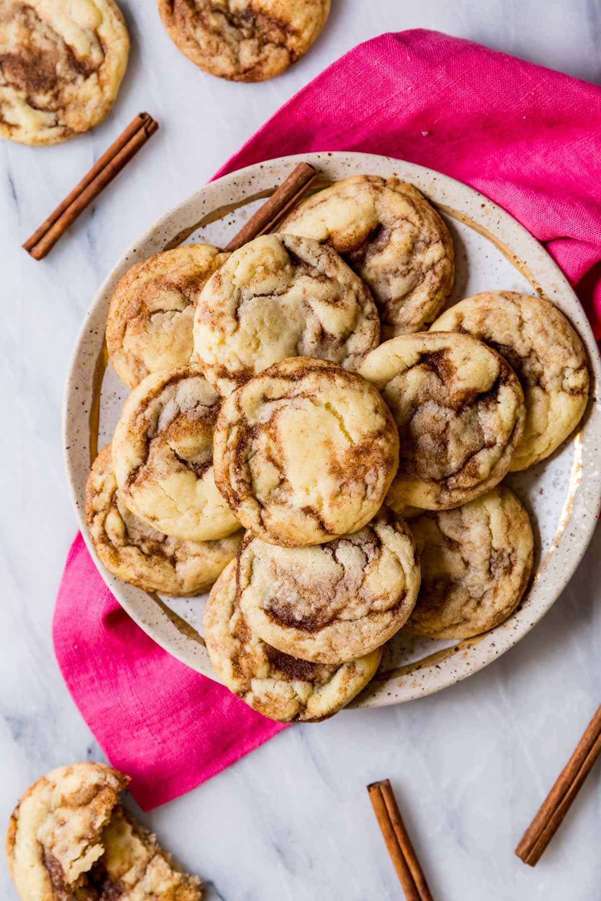 Overhead view of a plate of cinnamon swirled cookies.