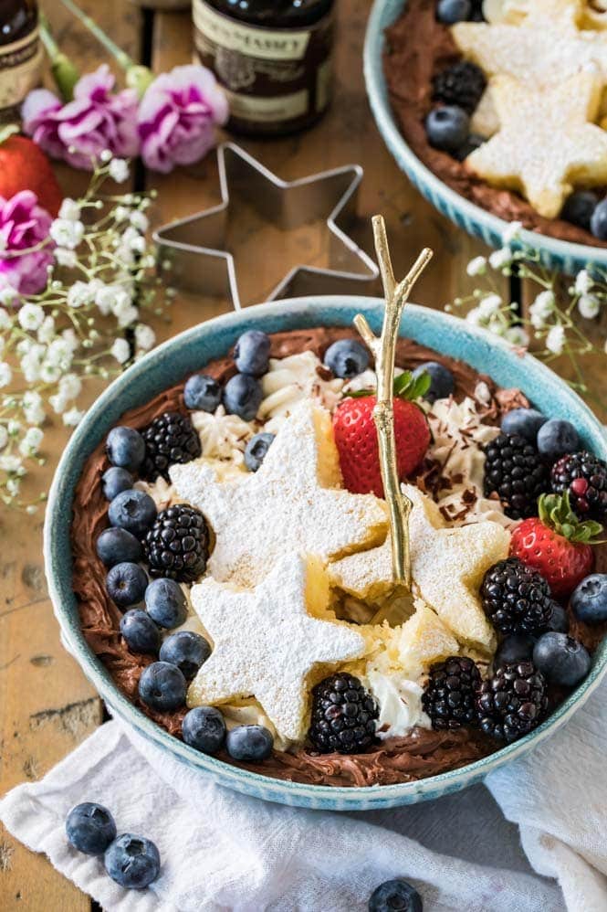 A dessert bowl with a bite out of the cake