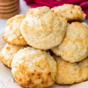 Homemade drop biscuits stacked in a pile