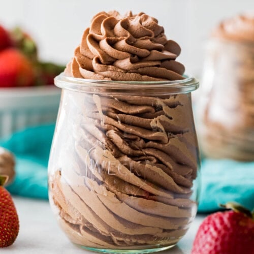 close-up view of chocolate whipped cream that's been piped into a small glass jar