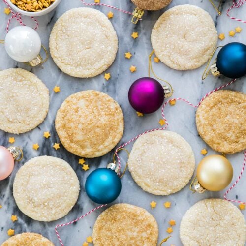 drop sugar cookies on marble surrounded by ornaments