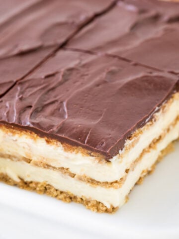 Sliced eclair cake in white baking dish