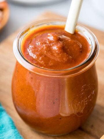 small glass jar of homemade BBQ sauce