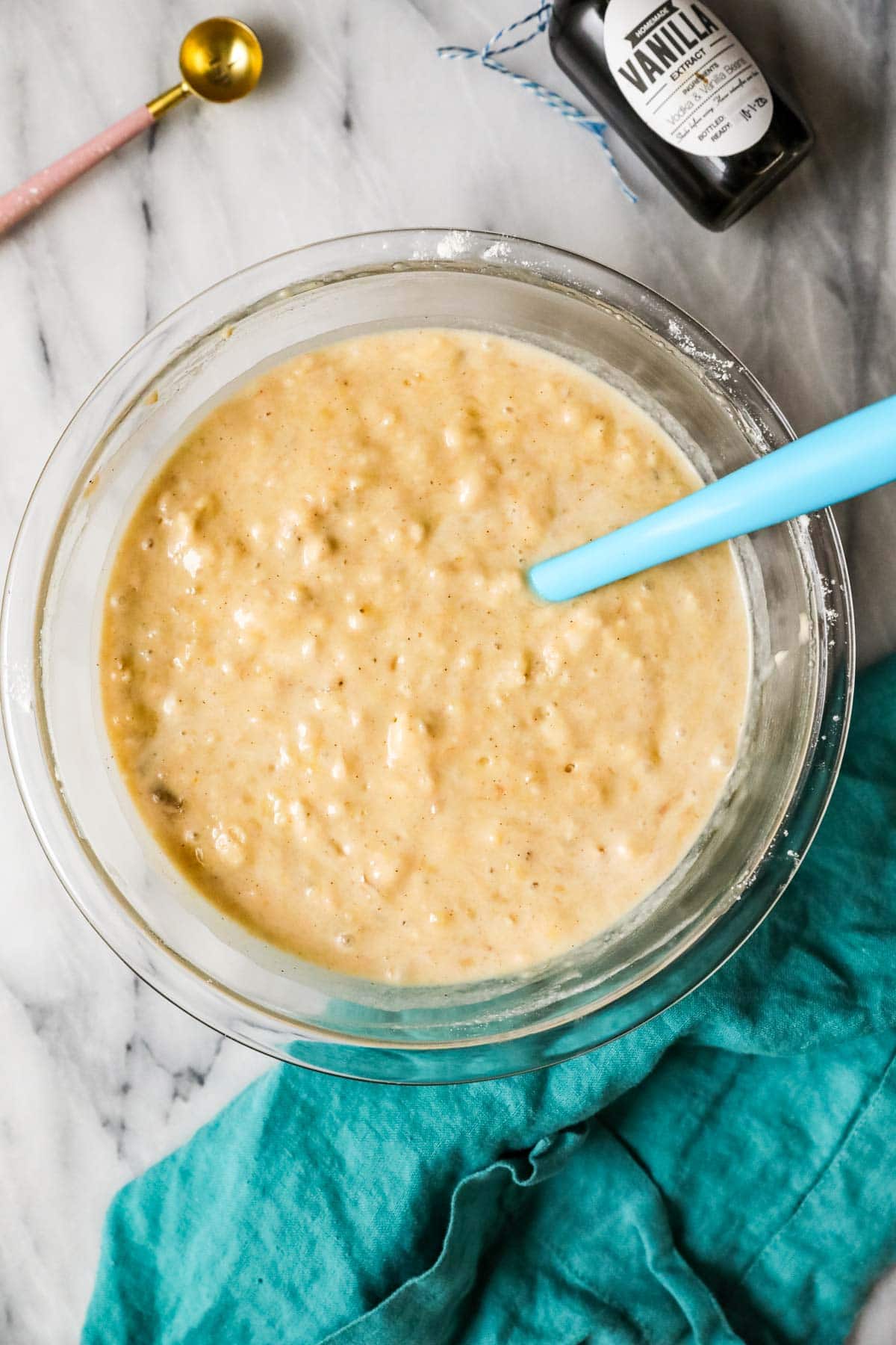 sourdough banana bread batter in glass mixing bowl