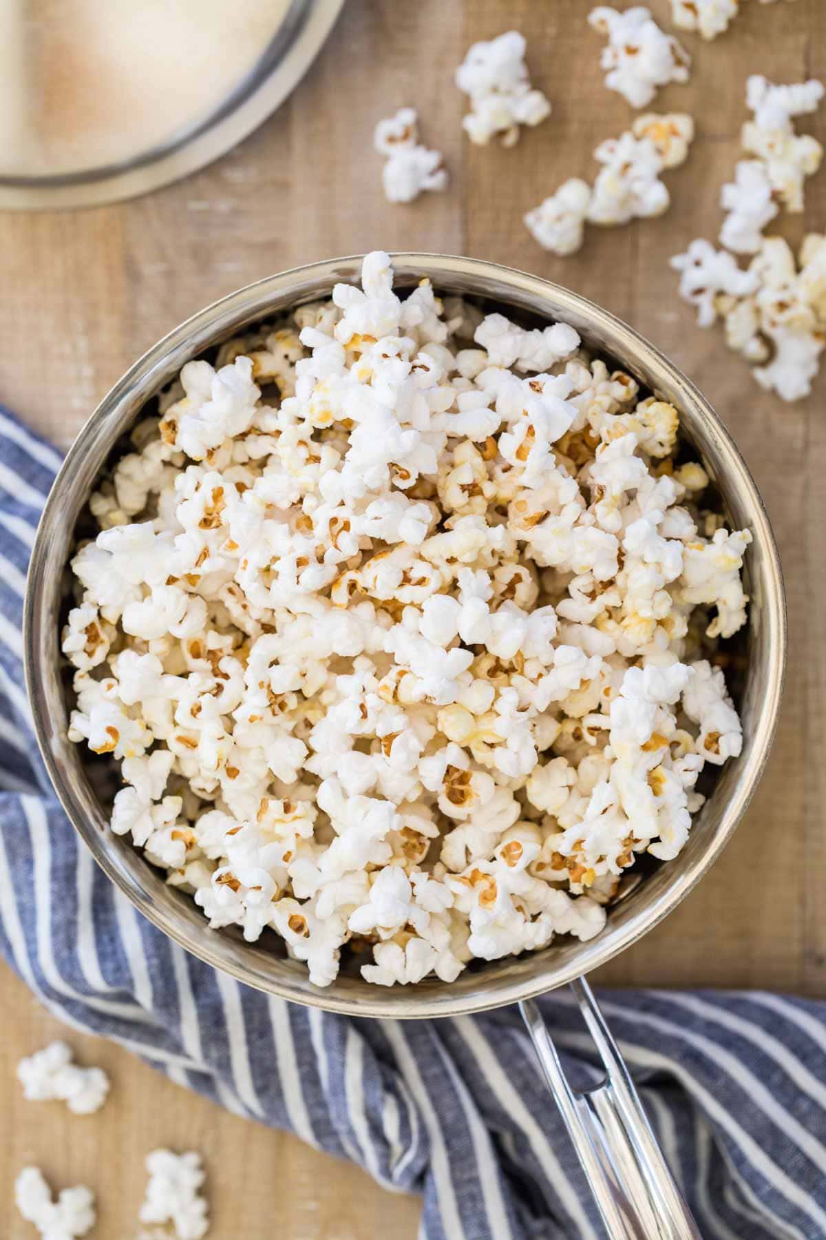 silver saucepan full of kettle corn