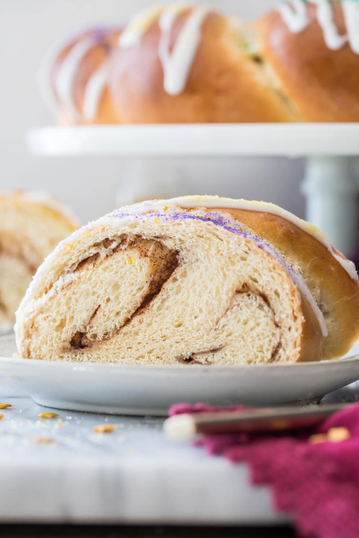 slice of king cake showing two distinct swirls of cinnamon sugar