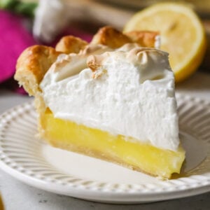 slice of lemon meringue pie on plate