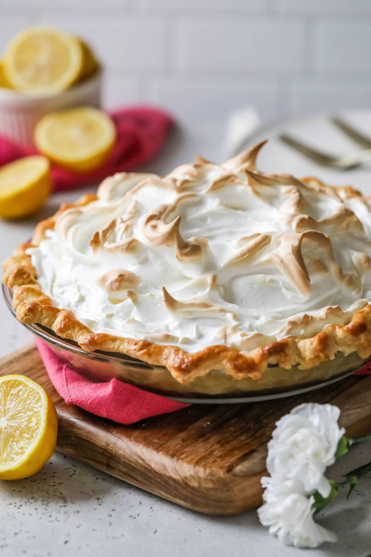 Lemon meringue pie with wispy meringue dollops that have been caramelized.