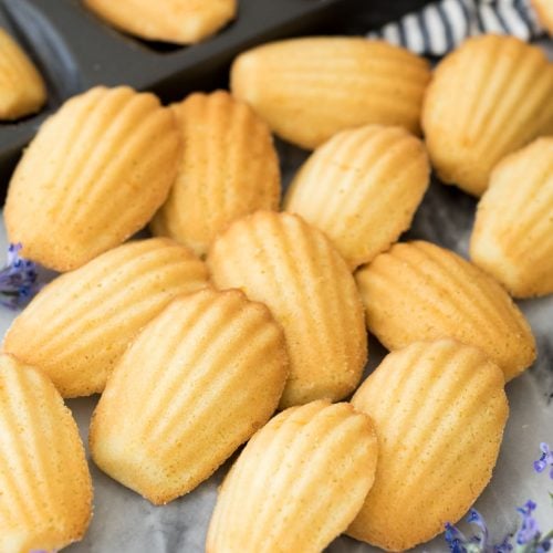 Madeleines arranged on marble board