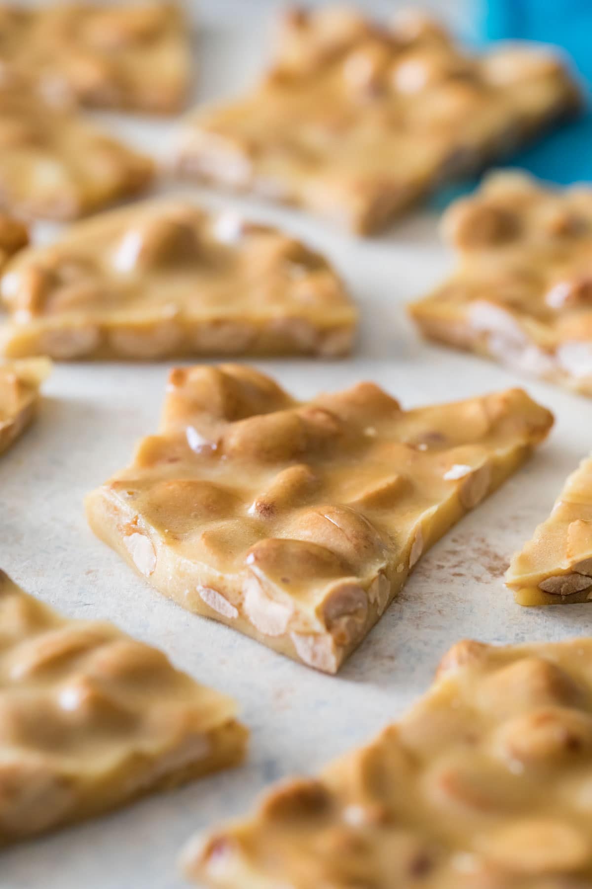 Close-up shot of irregular pieces of peanut candy.