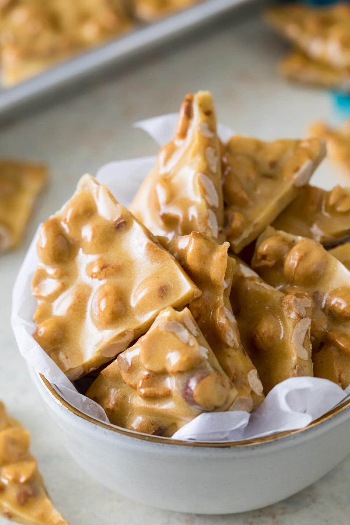 Overhead view of a bowl of peanut candy pieces.