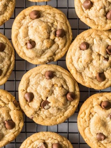 Overhead view of peanut butter chocolate chip cookies on a cooling rack.