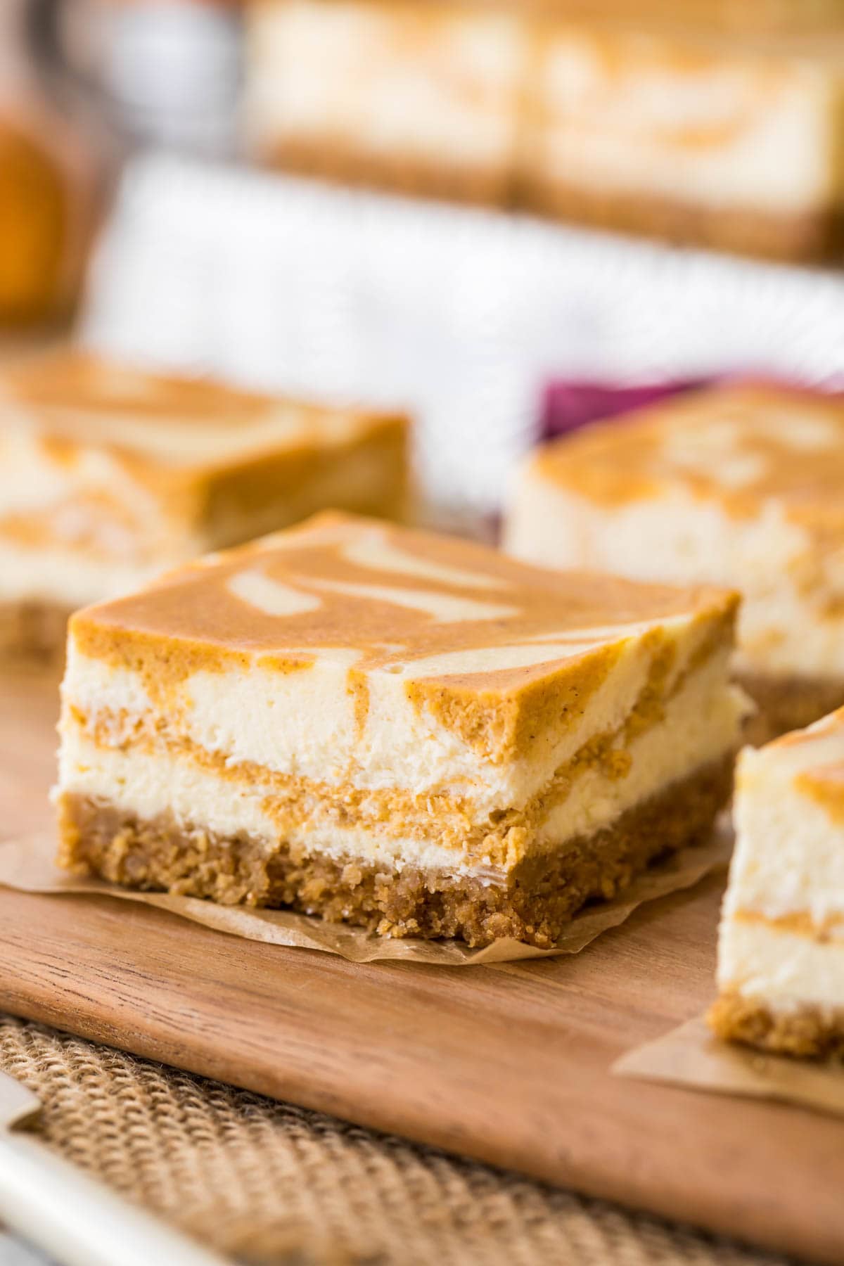 Close-up of a swirled pumpkin cheesecake bar.