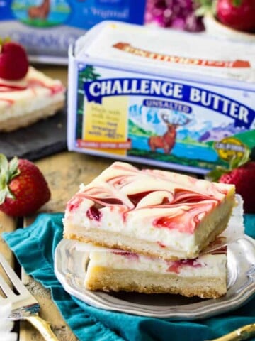 Stack of two raspberry swirl cheesecake bars