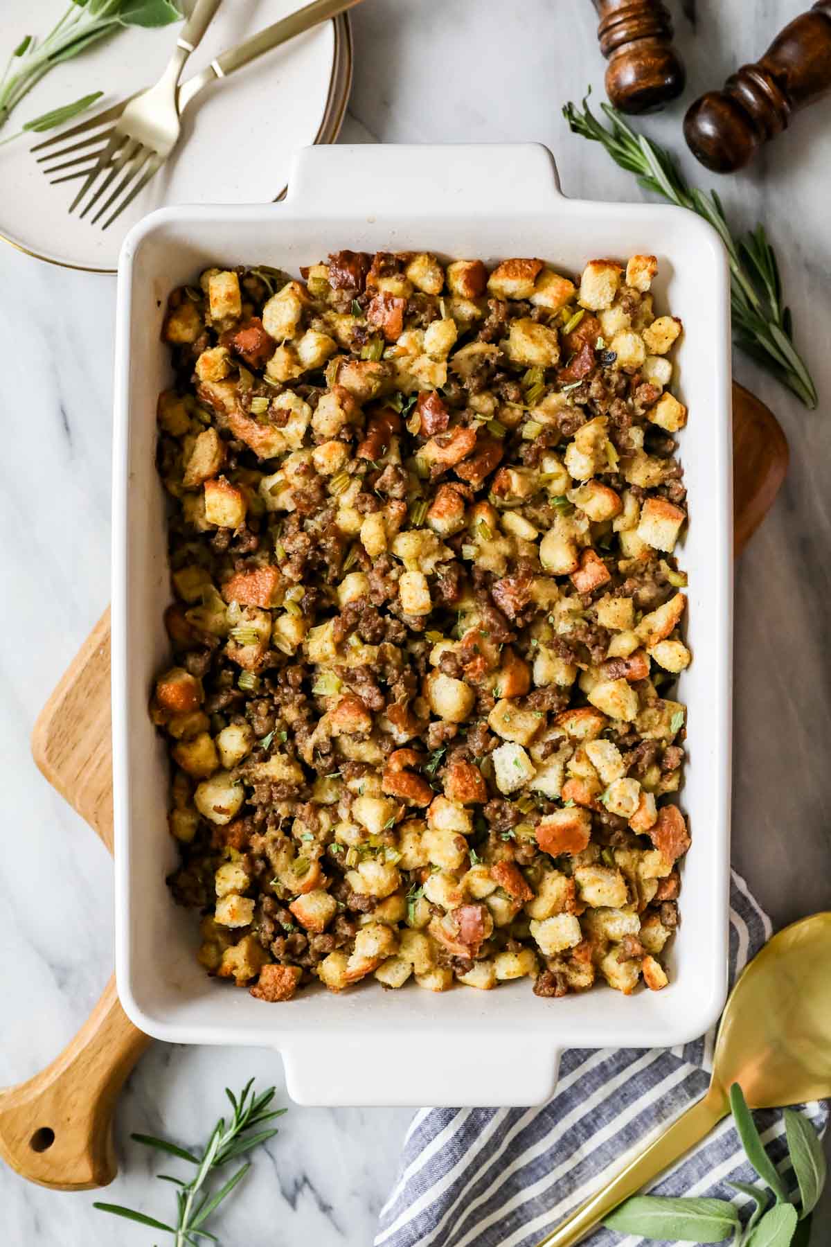 Overhead view of a stuffing made with sausage, celery, and onions after cooking.