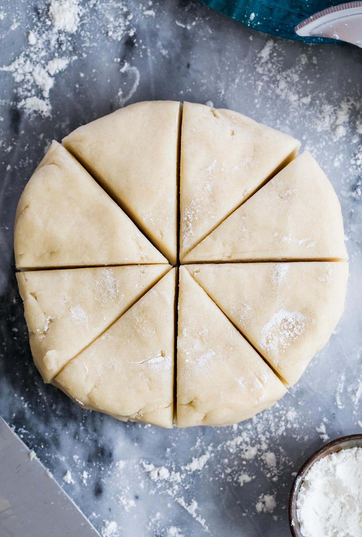 scone dough formed into disc and cut into wedges